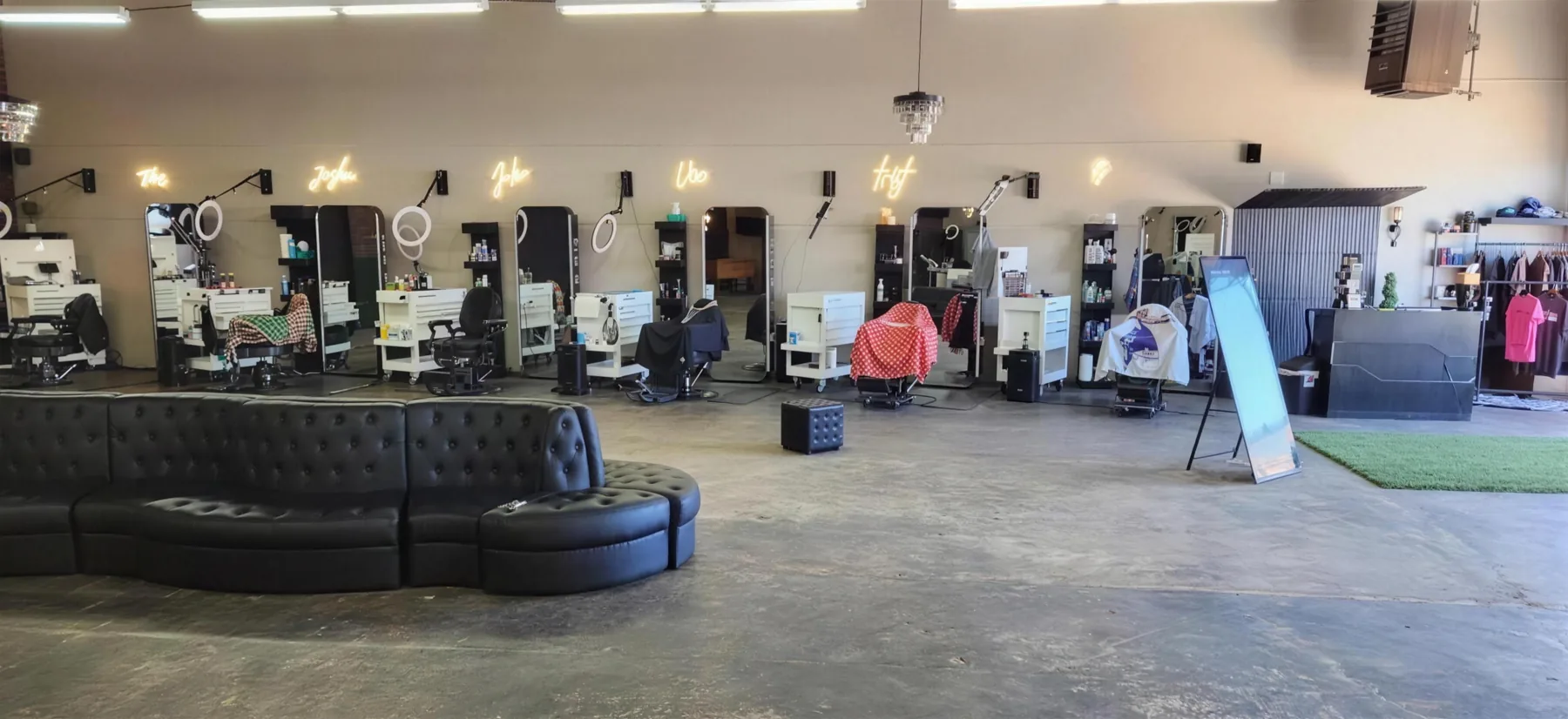 The waiting lounge and barber stations at House of Fadez